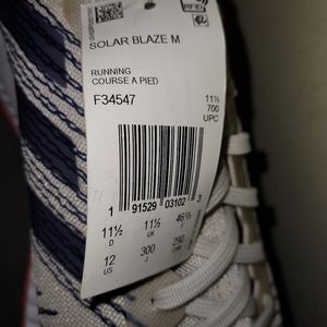 New never worn shoes Adidas, size 12, white blue and orange in color.
